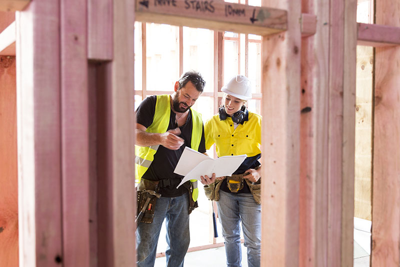 Two construction workers